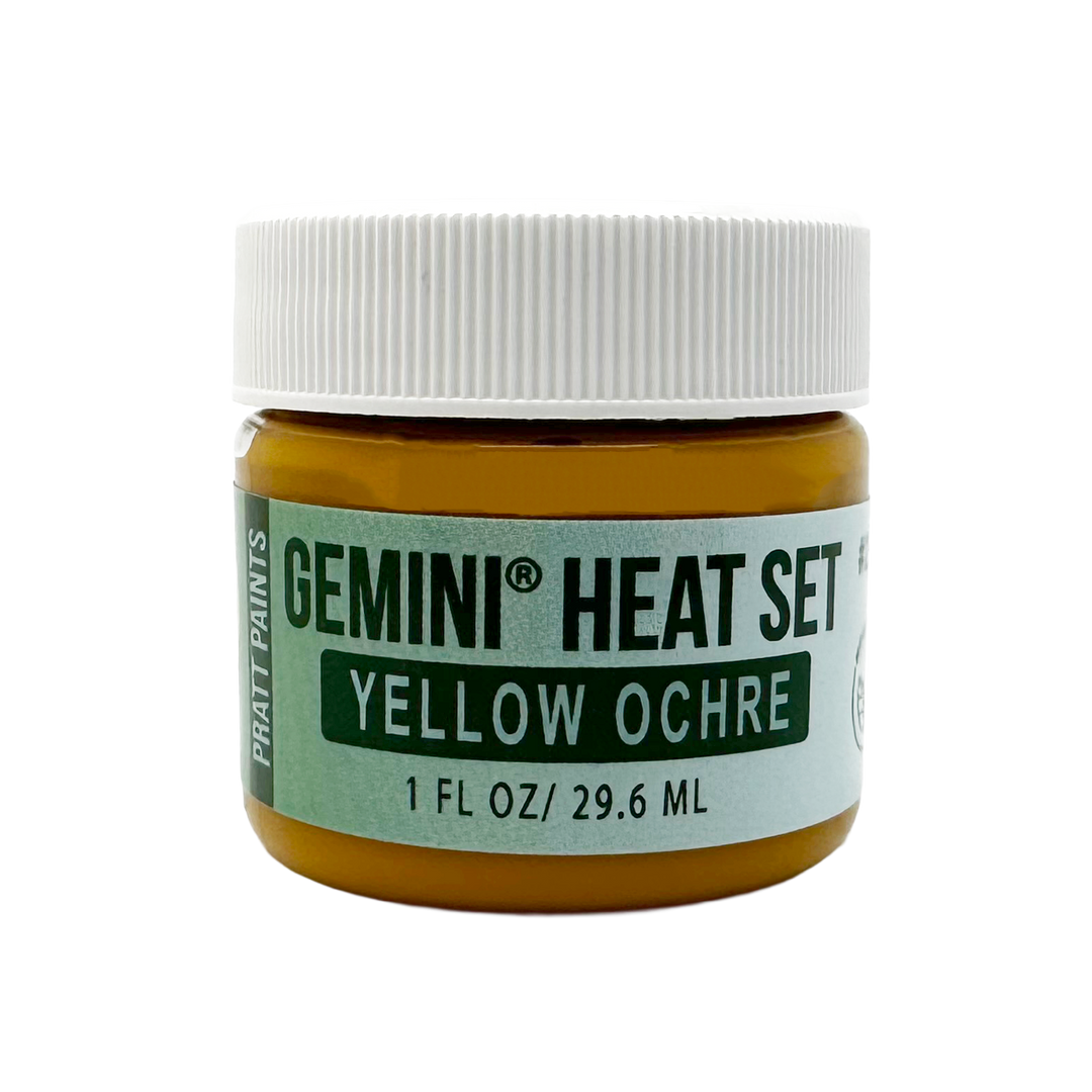 Jar of Gemini Heat Set Yellow Ochre paint with a white lid on a white background